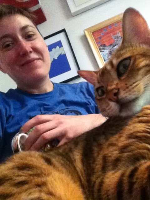Here I am, still in my PJs, with a cup of coffee, and a little kitty inspiration on my lap. Time to write!
